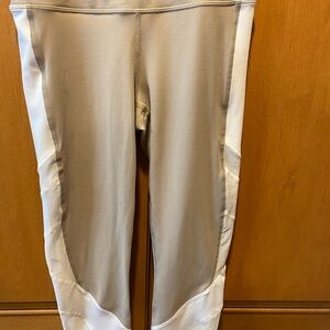 Athleta cropped leggings in tan & white with mesh panels on the leg. Size: S